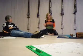 Students using props in an Iyengar yoga class